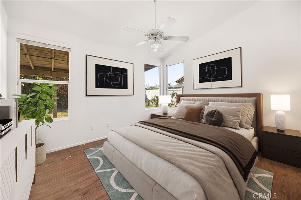 4546 Spring Court Banning, CA 92220 - Photo 11 of 17 a bedroom with a bed and a flat screen tv