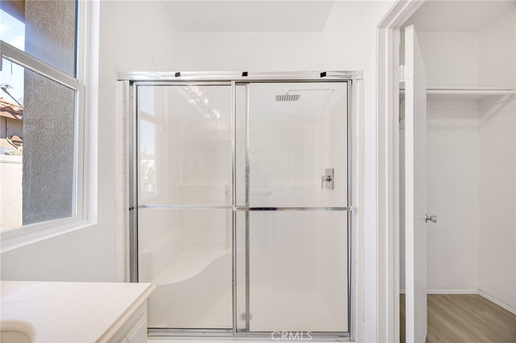 4546 Spring Court Banning, CA 92220 - Photo 13 of 17 a bathroom with a shower and a sink