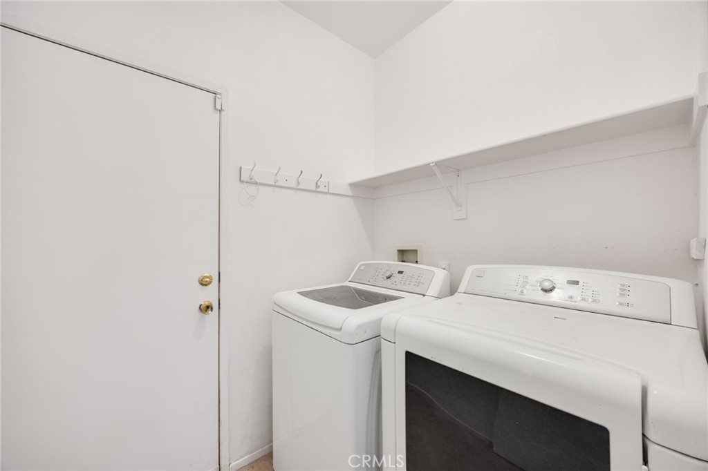 4546 Spring Court Banning, CA 92220 - Photo 15 of 17 a utility room with dryer and washer
