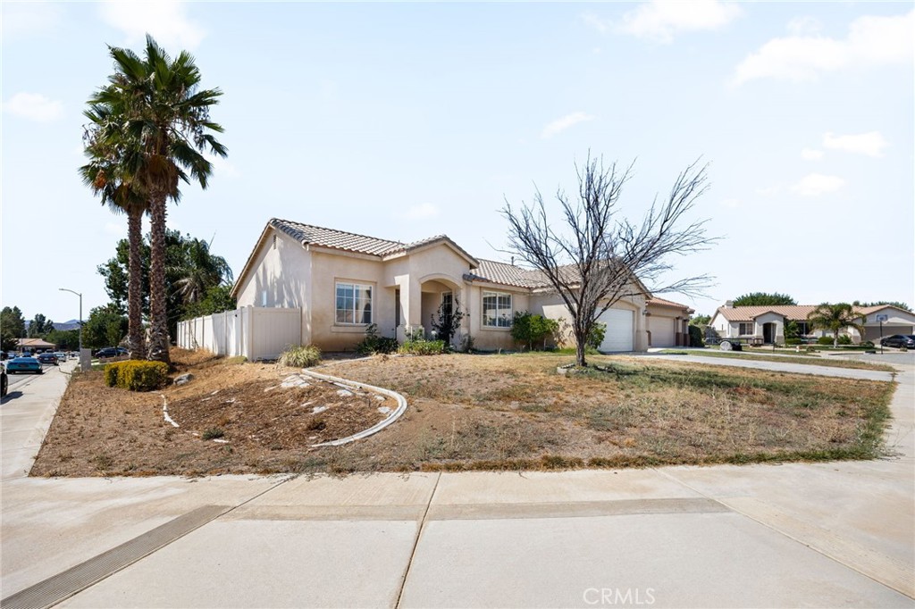 4546 Spring Court Banning, CA 92220 - Photo 2 of 17 a front view of a house with a yard