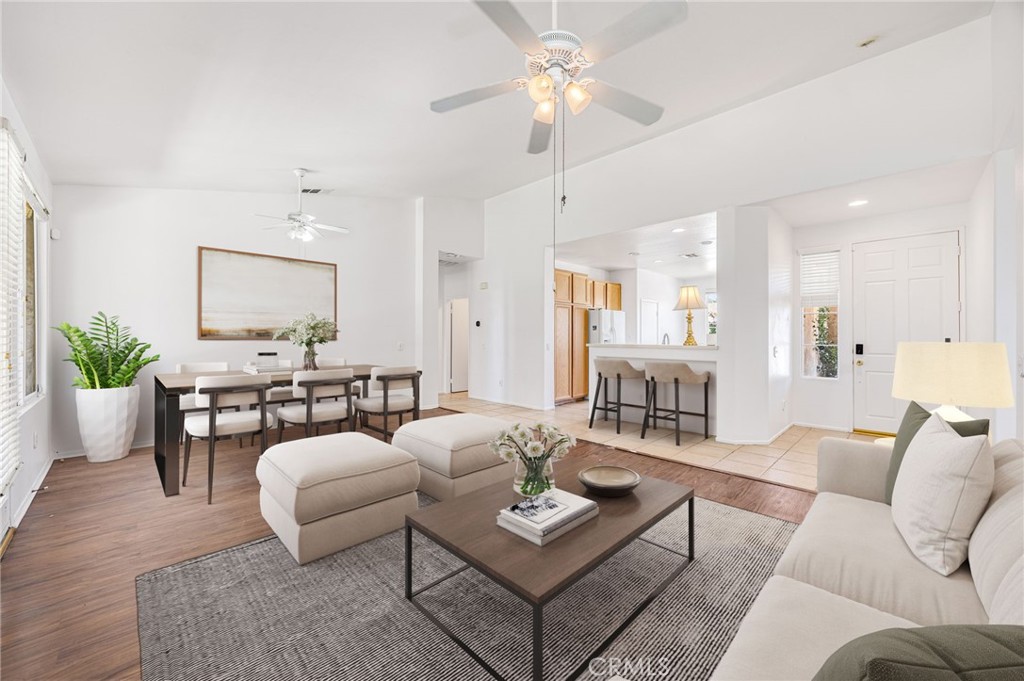 4546 Spring Court Banning, CA 92220 - Photo 4 of 17 a living room with furniture kitchen view and a chandelier