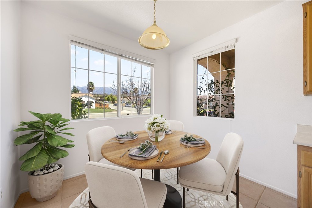 4546 Spring Court Banning, CA 92220 - Photo 7 of 17 a view of a dining room with furniture window and wooden floor