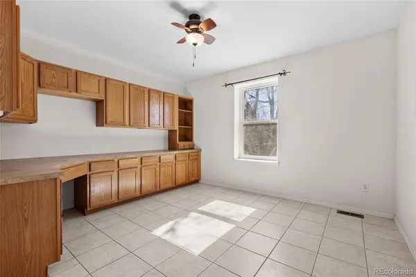 a kitchen with cabinets a sink and appliances