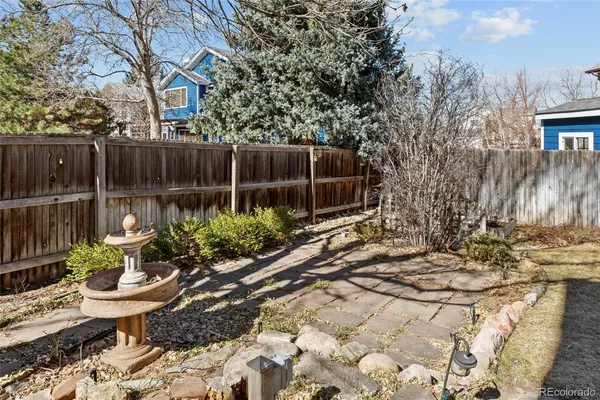 a front view of a house with a yard covered in snow