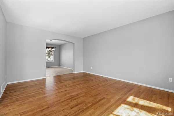 a view of a room with window and chandelier