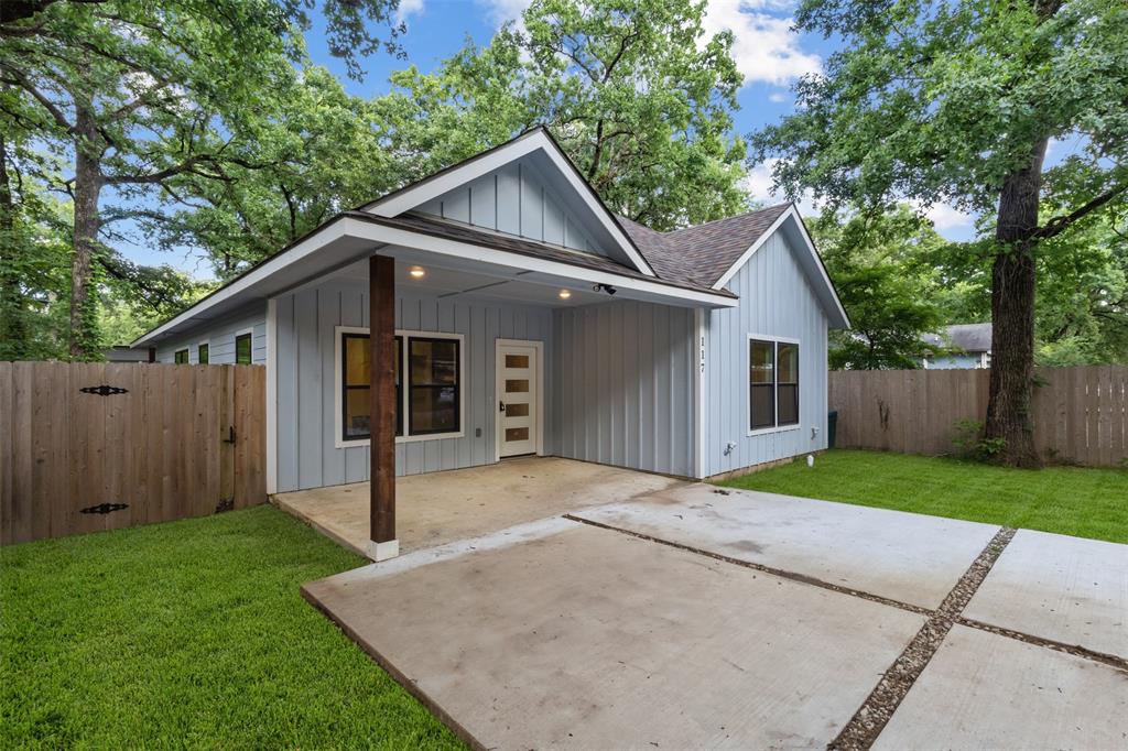 117 Pawnee Trail Mabank, TX 75156 - Photo 2 of 40 a view of a house with a yard and large tree