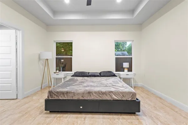 a bedroom with a bed and a table