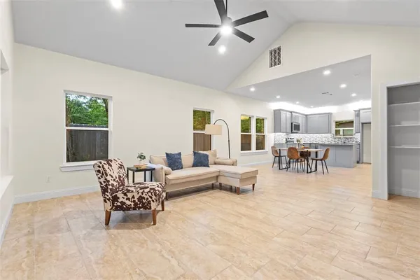 a living room with furniture and window