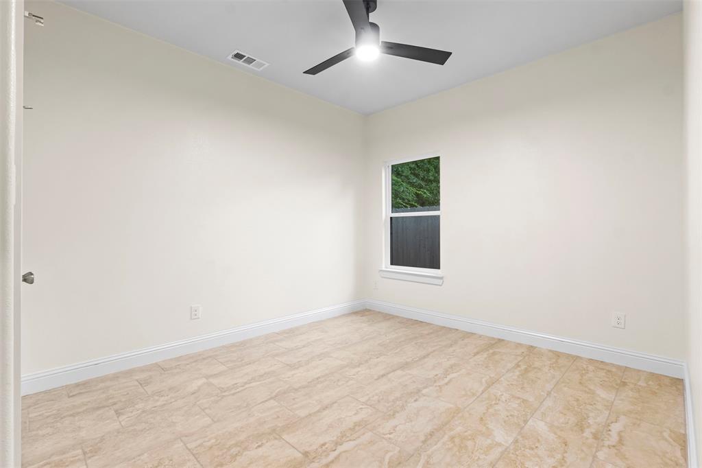 117 Pawnee Trail Mabank, TX 75156 - Photo 39 of 40 an empty room with a empty space and a window