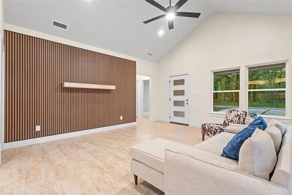 a living room with furniture and window