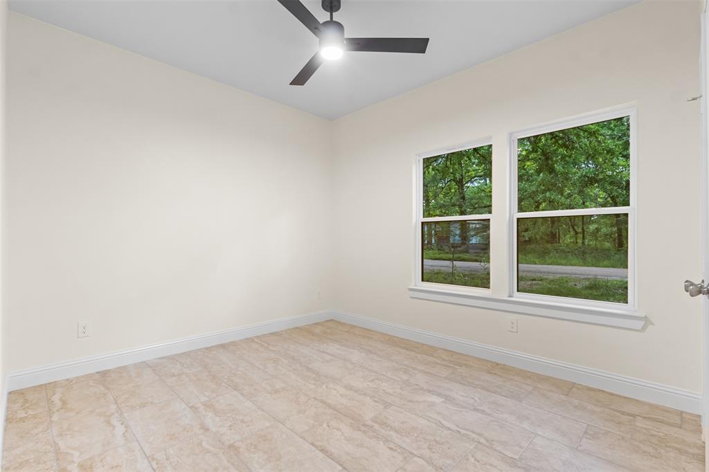 117 Pawnee Trail Mabank, TX 75156 - Photo 5 of 40 an empty room with a window