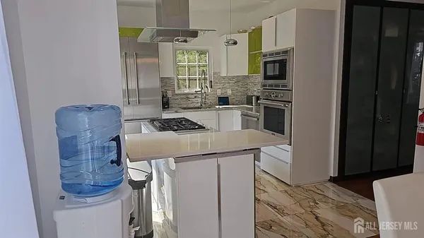 a kitchen that has a cabinets and a stove