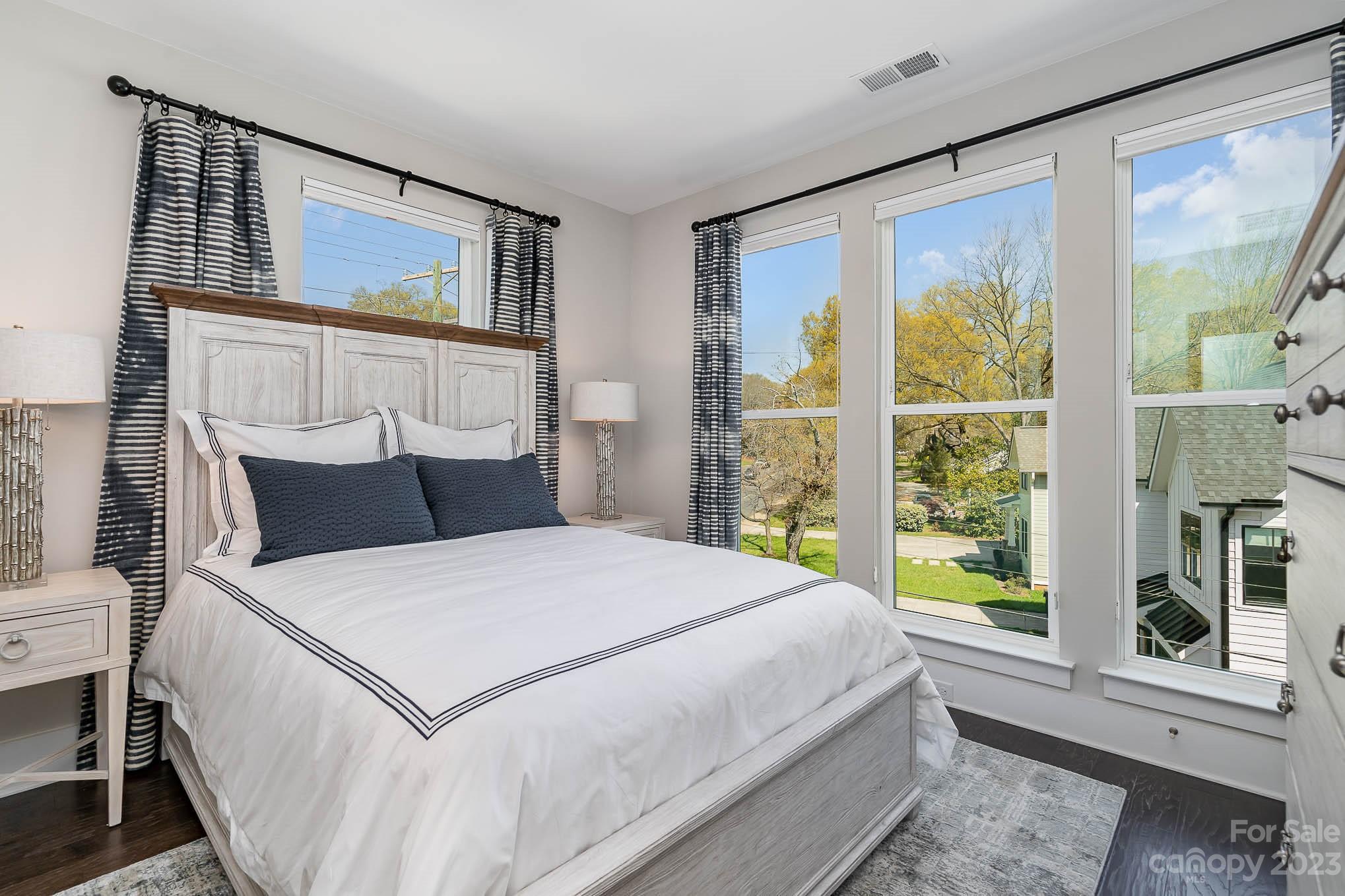 1103 Reece Road Charlotte, NC 28209 - Photo 14 of 32 a bedroom with a large bed and a window