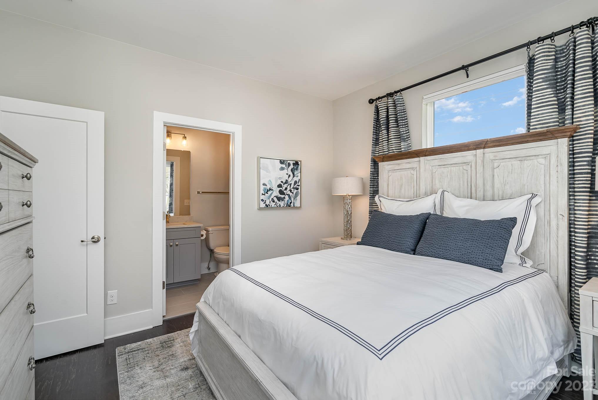 1103 Reece Road Charlotte, NC 28209 - Photo 15 of 32 a large white bed in a white room