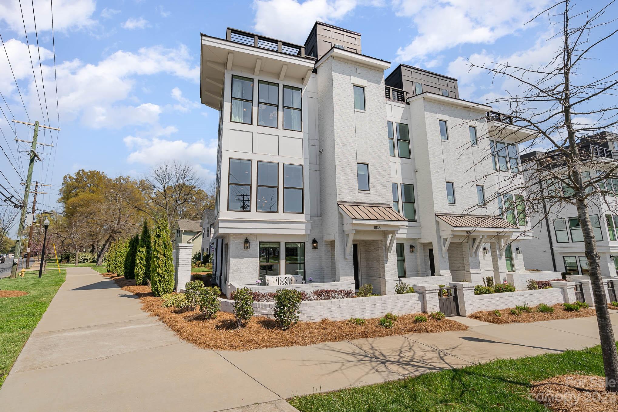 1103 Reece Road Charlotte, NC 28209 - Photo 2 of 32 a view of a building with a yard in front of it