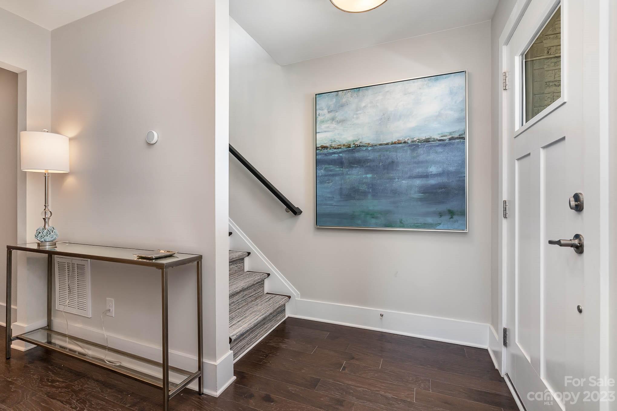 1103 Reece Road Charlotte, NC 28209 - Photo 21 of 32 a view of an empty room with wooden floor and a window