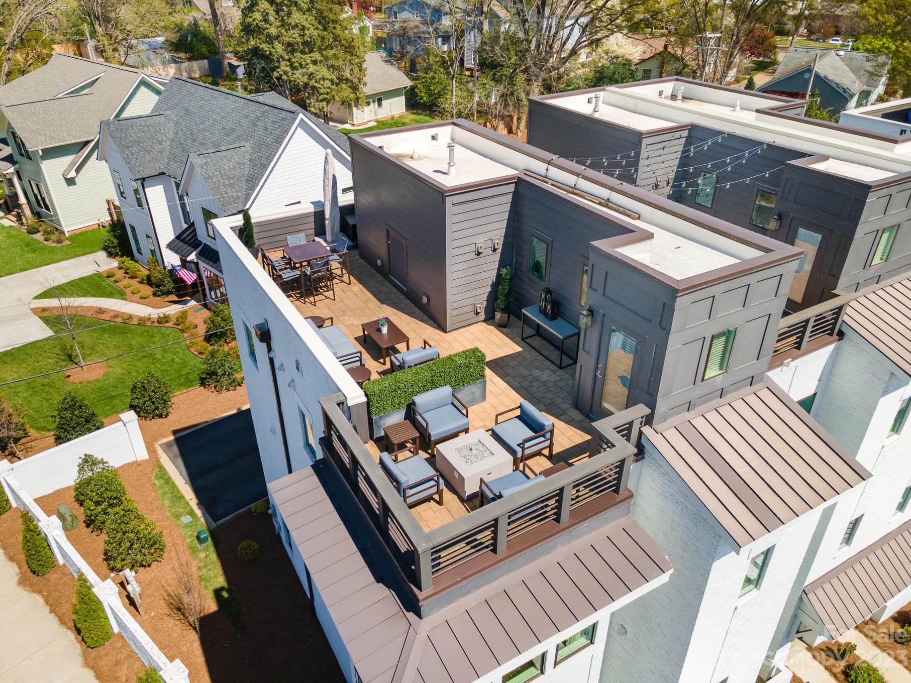 1103 Reece Road Charlotte, NC 28209 - Photo 23 of 32 an aerial view of a house with balcony and patio
