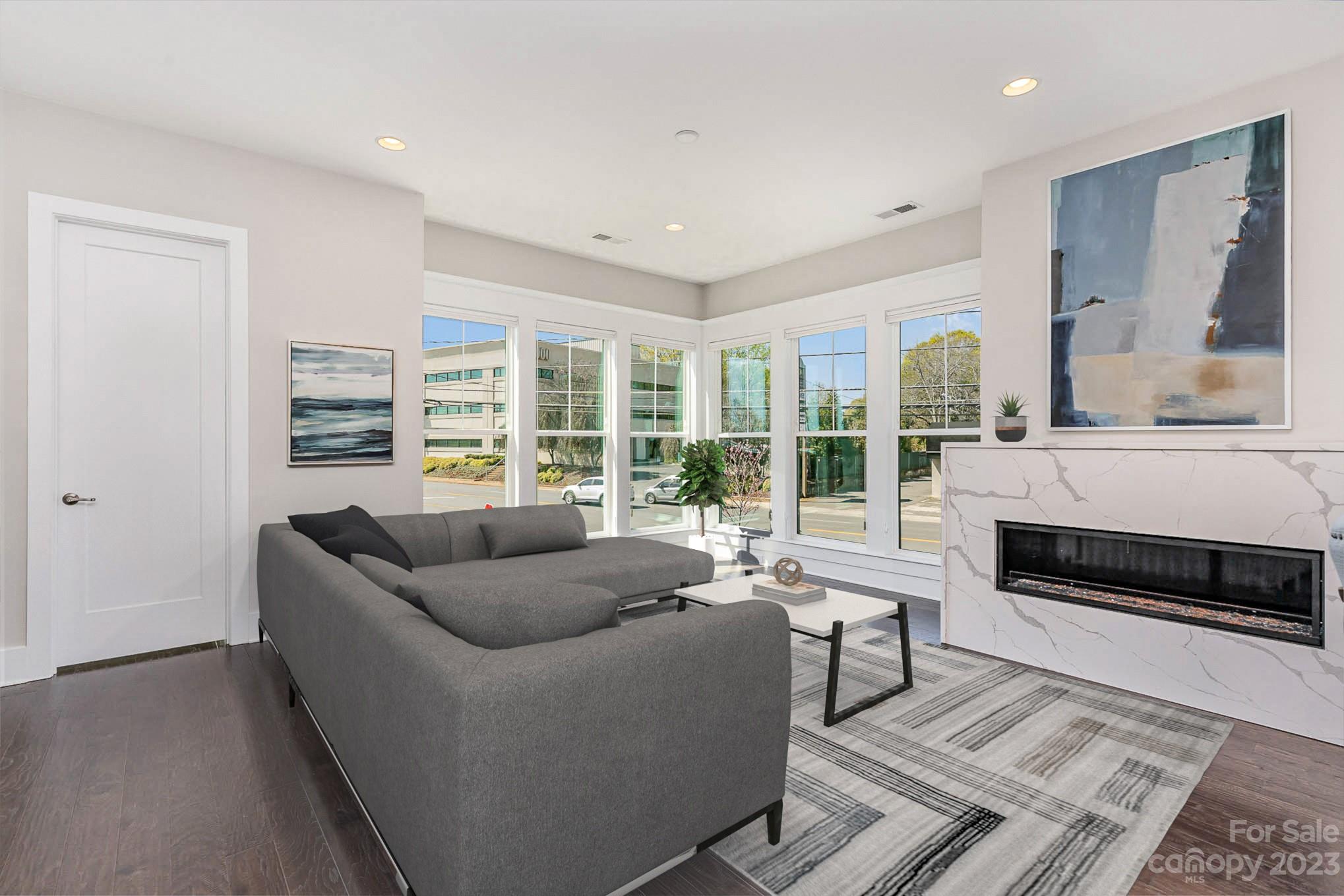 1103 Reece Road Charlotte, NC 28209 - Photo 4 of 32 a living room with furniture and a fireplace