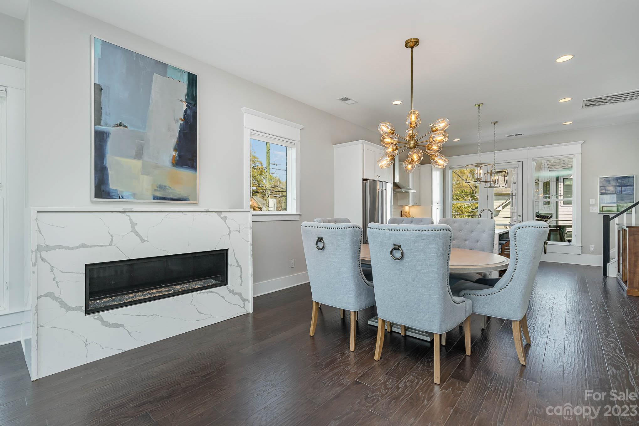 1103 Reece Road Charlotte, NC 28209 - Photo 8 of 32 a view of a dining room with furniture and wooden floor