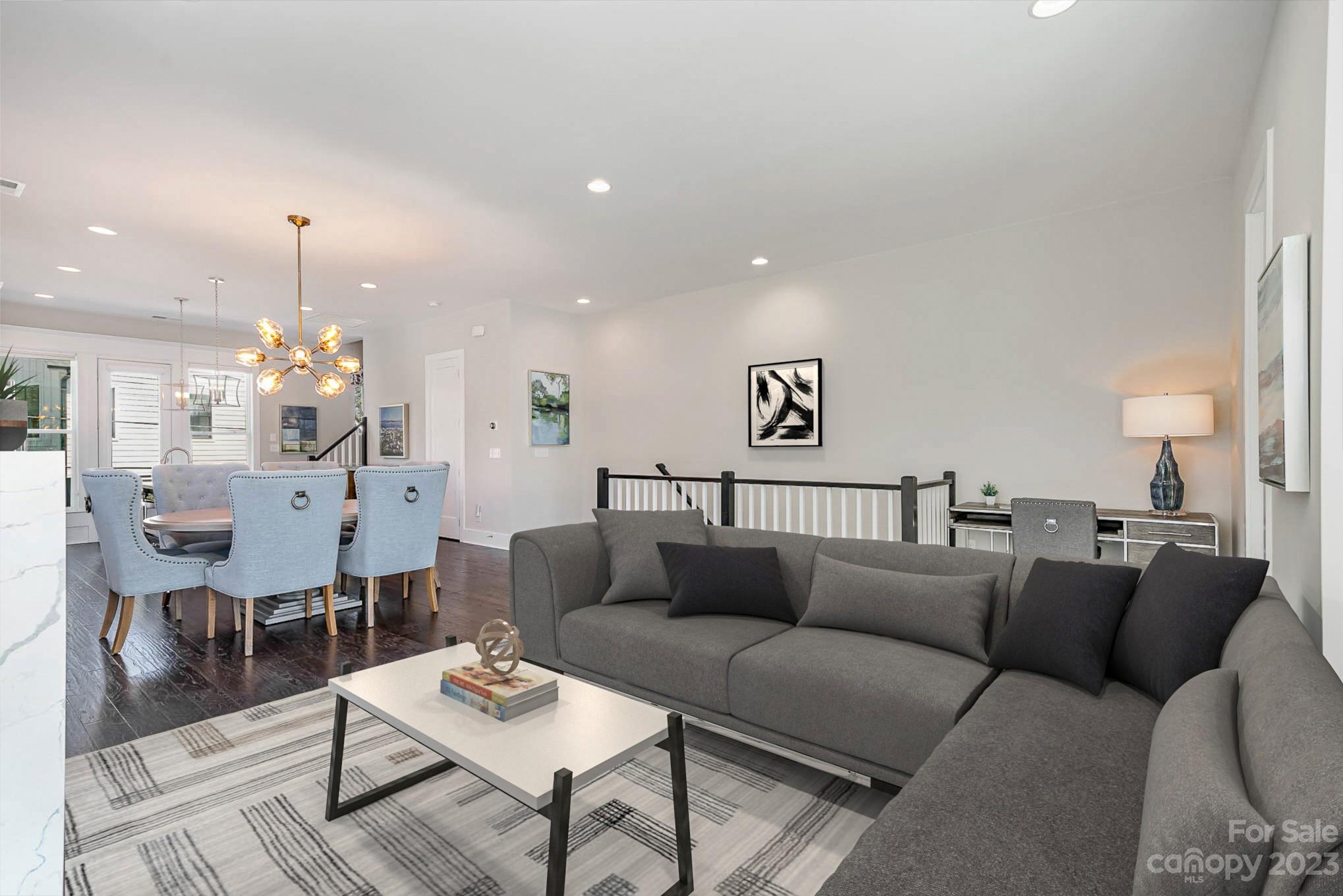 1103 Reece Road Charlotte, NC 28209 - Photo 10 of 32 a living room with furniture kitchen view and a chandelier