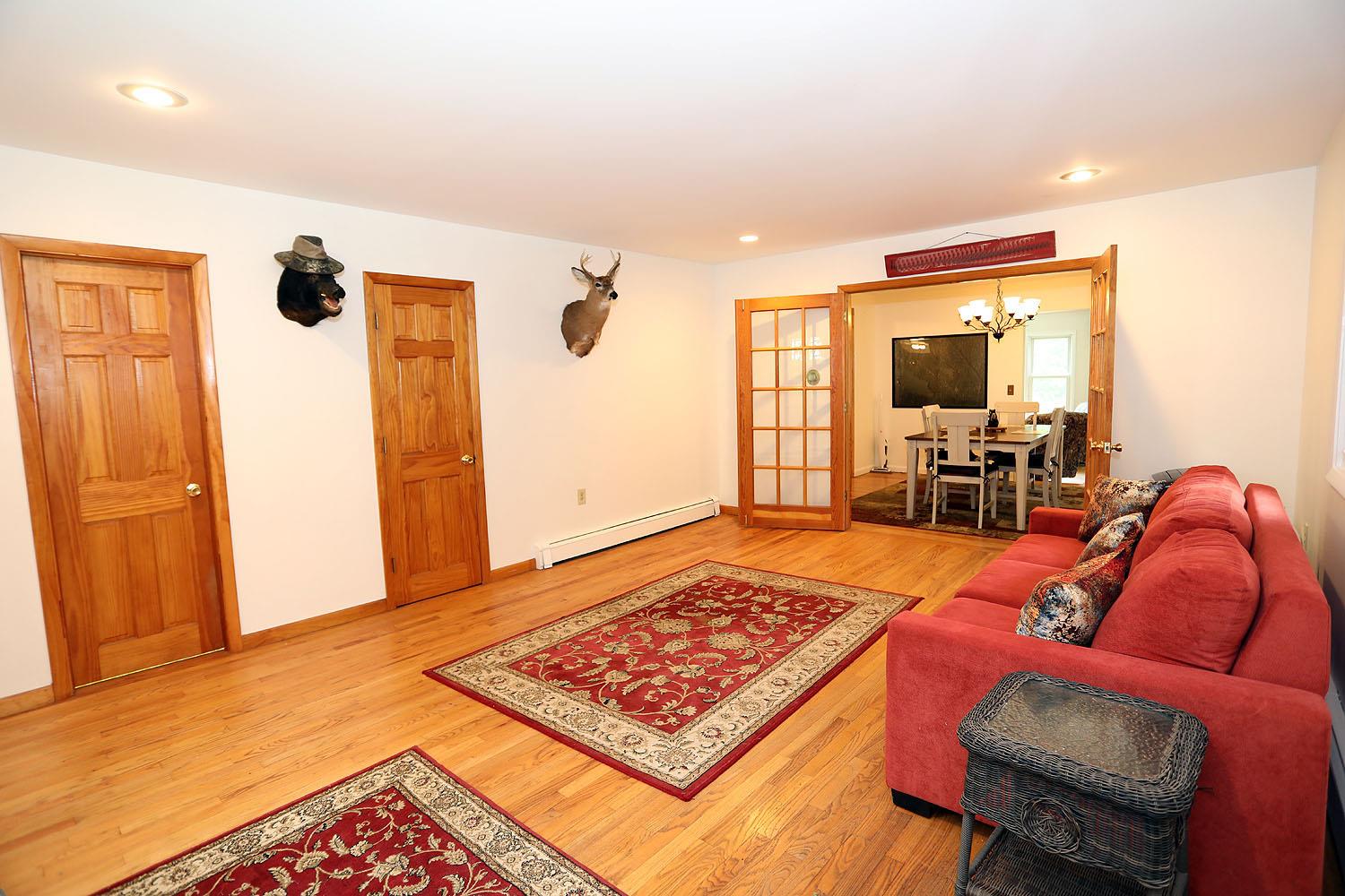 342 Bernas Road Cochecton, NY 12726 - Photo 17 of 48 a living room with furniture and a rug