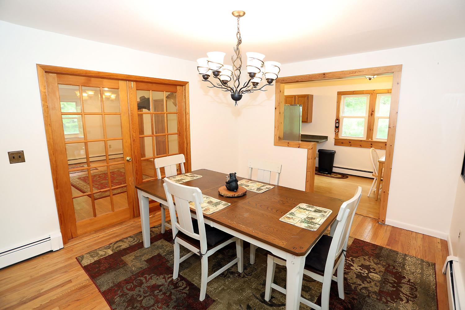 342 Bernas Road Cochecton, NY 12726 - Photo 19 of 48 a view of a dining room with furniture window and wooden floor