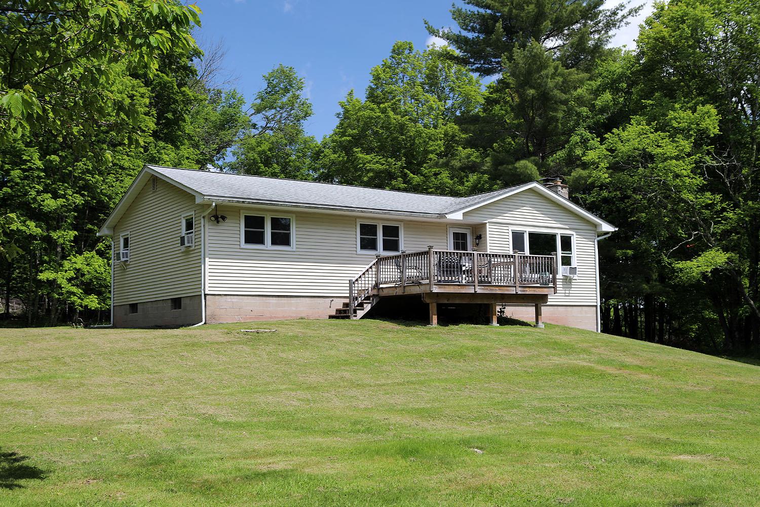 342 Bernas Road Cochecton, NY 12726 - Photo 20 of 48 a view of a house with yard and porch