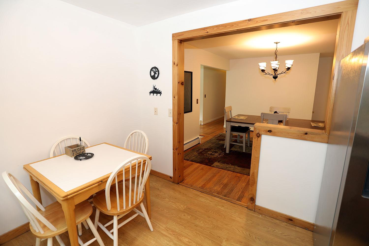 342 Bernas Road Cochecton, NY 12726 - Photo 24 of 48 a view of a dining room with furniture and wooden floor