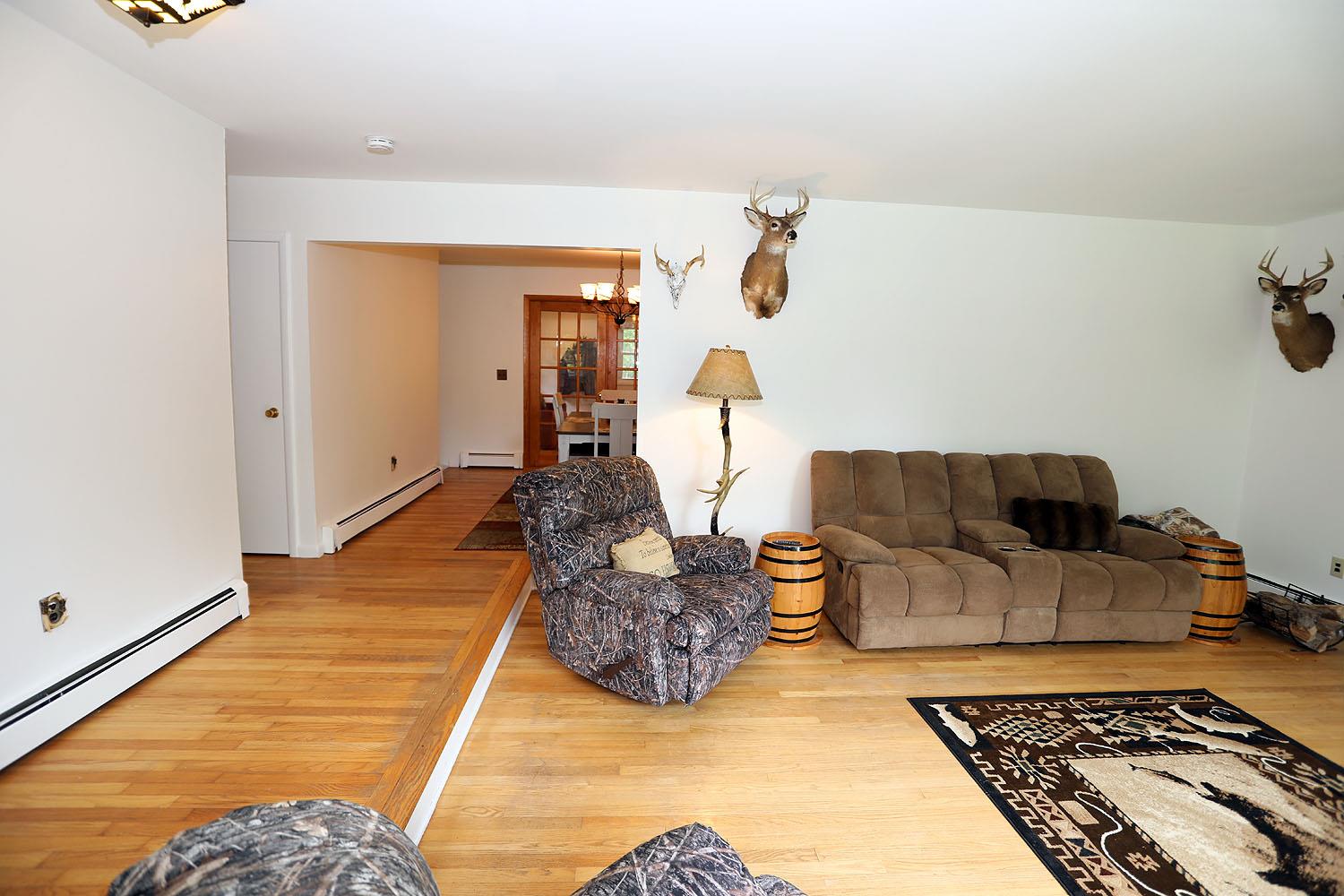 342 Bernas Road Cochecton, NY 12726 - Photo 26 of 48 a living room with furniture rug and a table