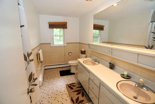 a bathroom with a sink and mirror