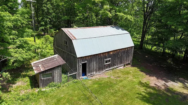 a view of a room with wooden walls