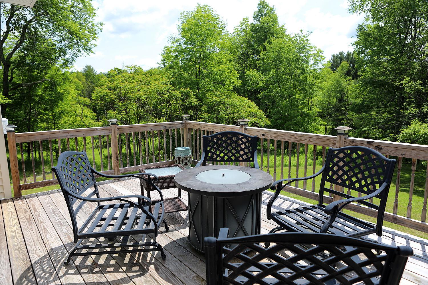 342 Bernas Road Cochecton, NY 12726 - Photo 5 of 48 a view of a chairs and table on the deck