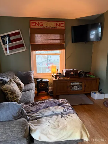 a room with furniture and a flat screen tv