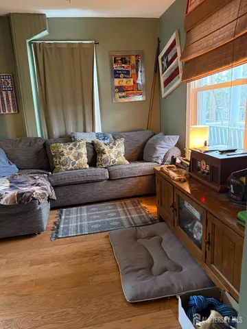 a bed room with furniture and a window