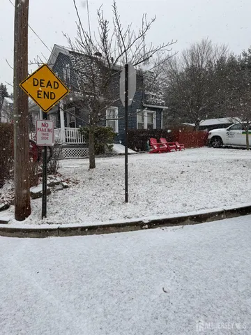 a side view of a house with a yard
