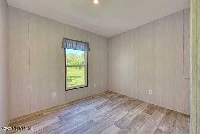 a view of a room that has a window in it