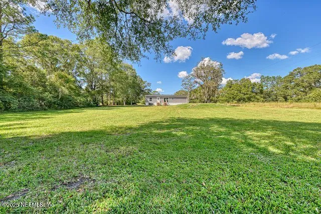 a view of a golf course with a lake