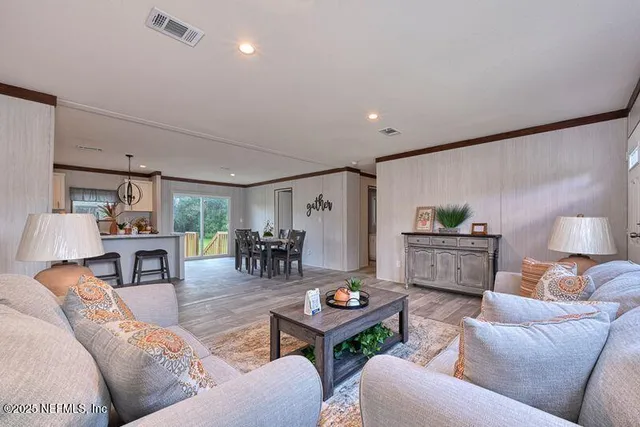 a living room with furniture and a table