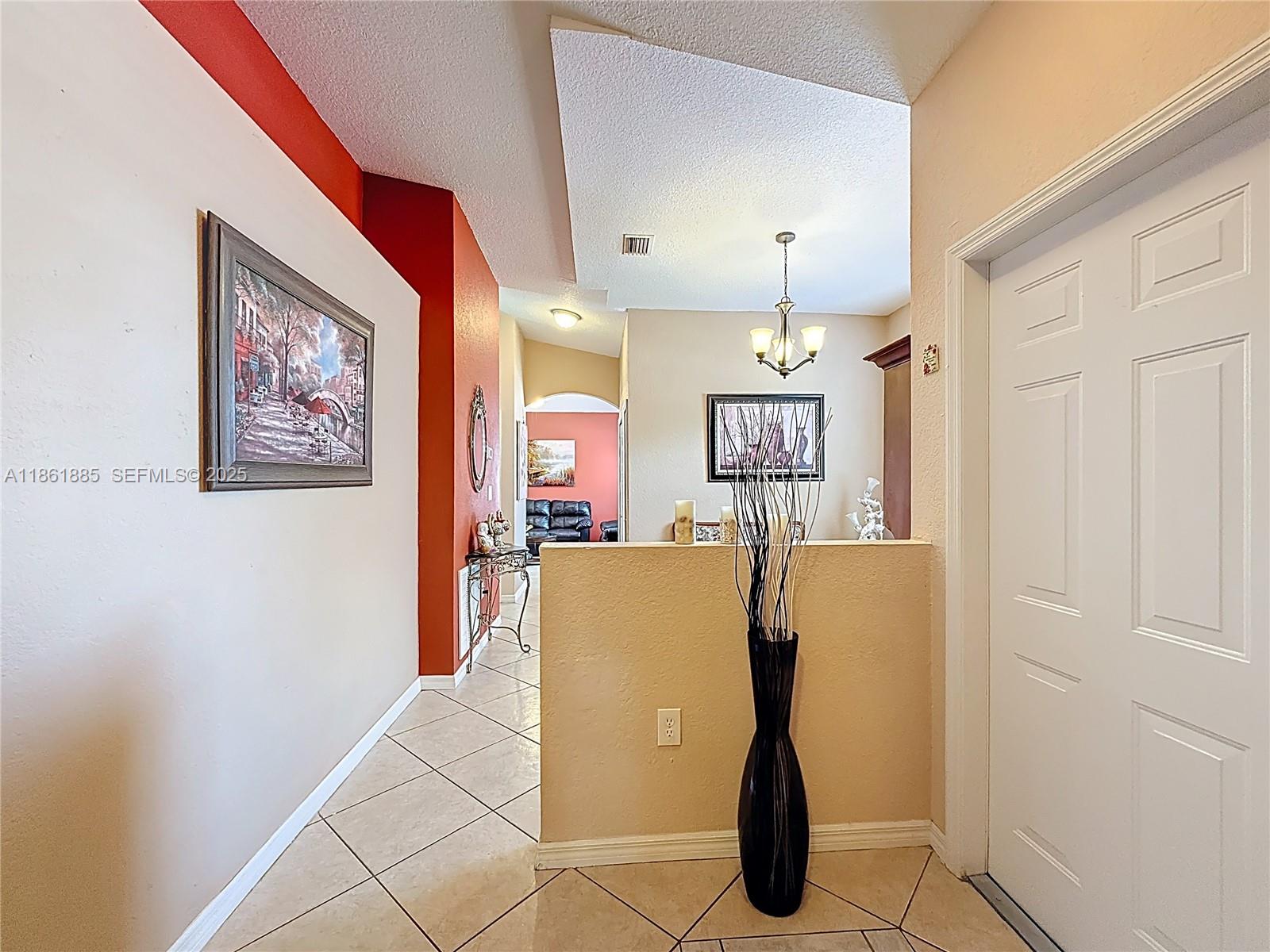 30030 Southwest 154th Avenue Homestead, FL 33033 - Photo 13 of 70 a view of a kitchen with fridge and workspace