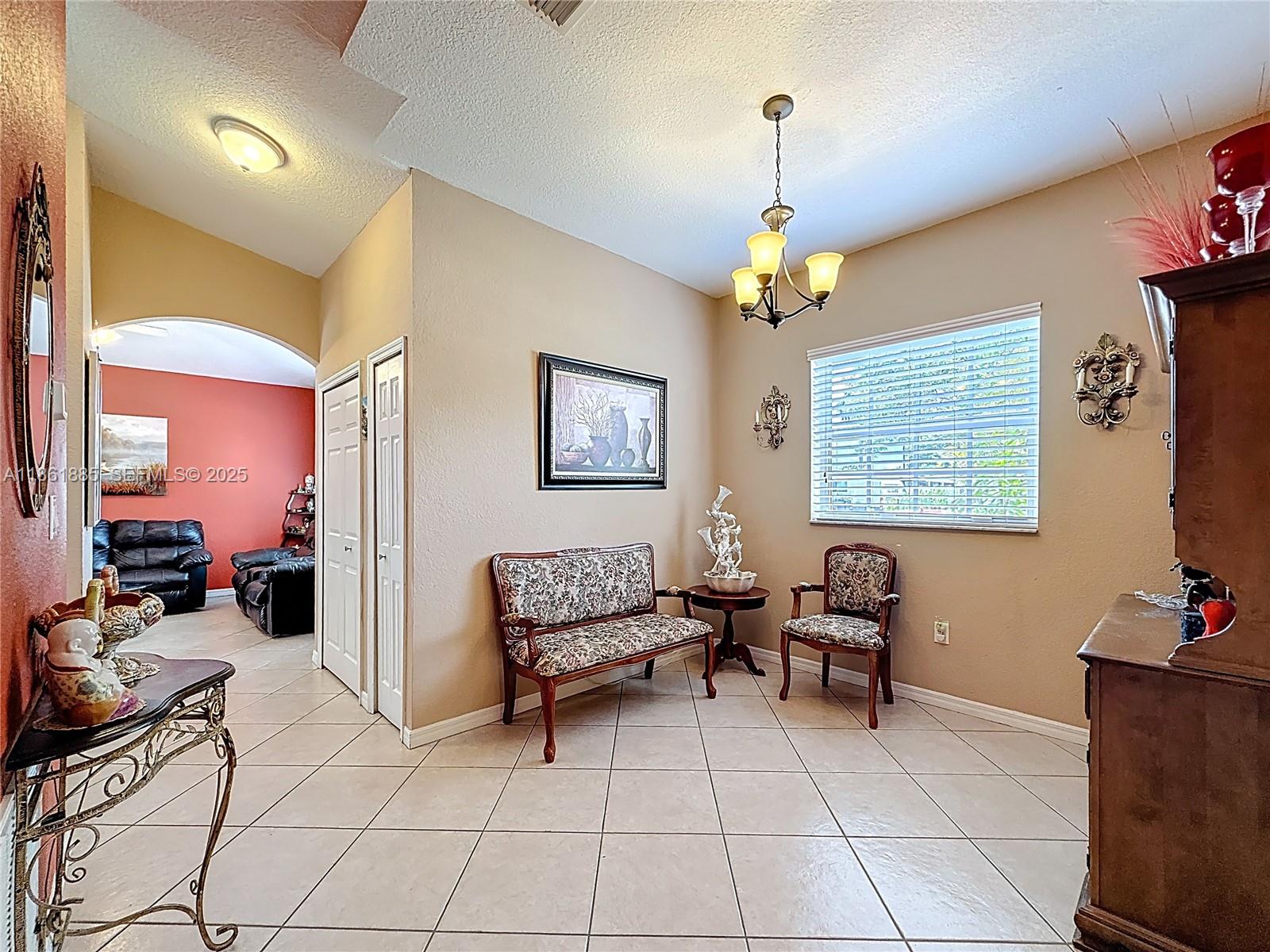 30030 Southwest 154th Avenue Homestead, FL 33033 - Photo 14 of 70 a bedroom with furniture and a window