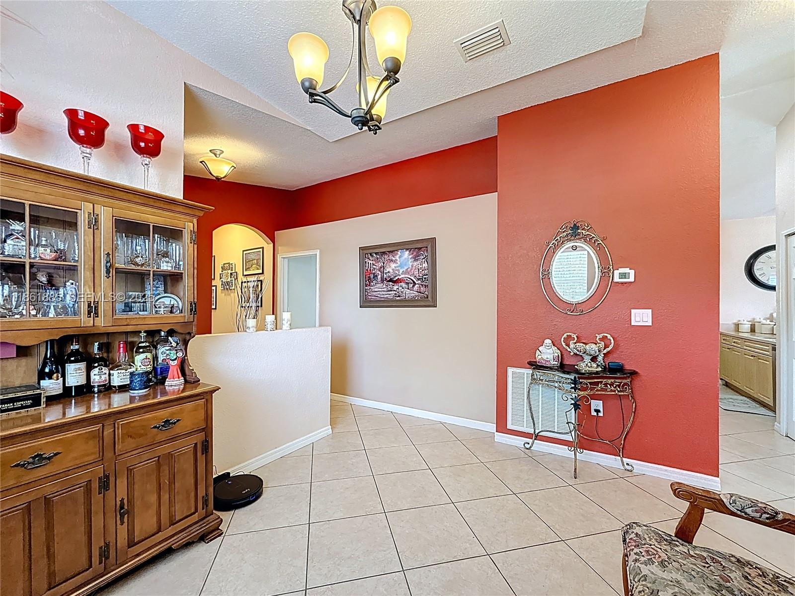 30030 Southwest 154th Avenue Homestead, FL 33033 - Photo 16 of 70 a kitchen with stainless steel appliances granite countertop a sink and cabinets