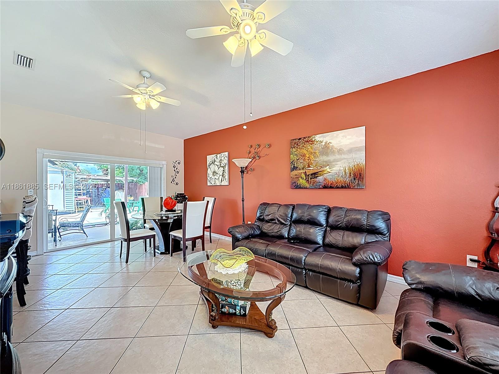 30030 Southwest 154th Avenue Homestead, FL 33033 - Photo 18 of 70 a living room with furniture and a flat screen tv