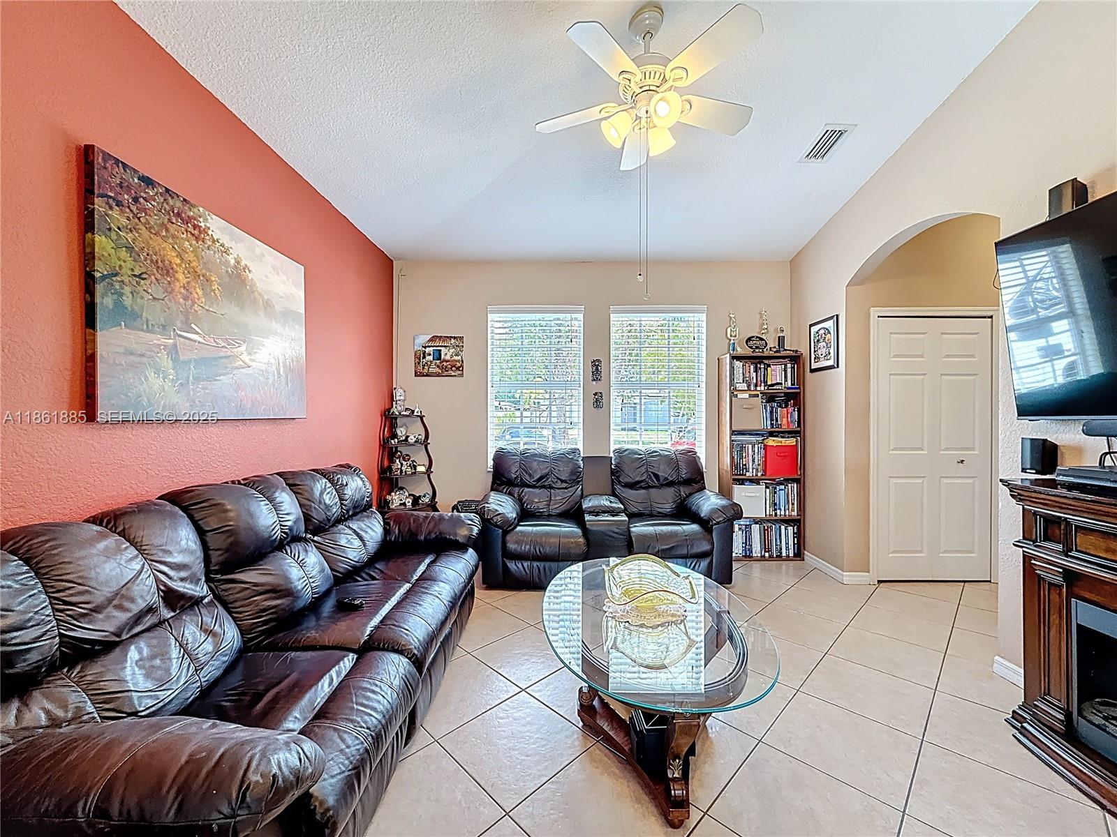 30030 Southwest 154th Avenue Homestead, FL 33033 - Photo 20 of 70 a living room with furniture a rug and a window