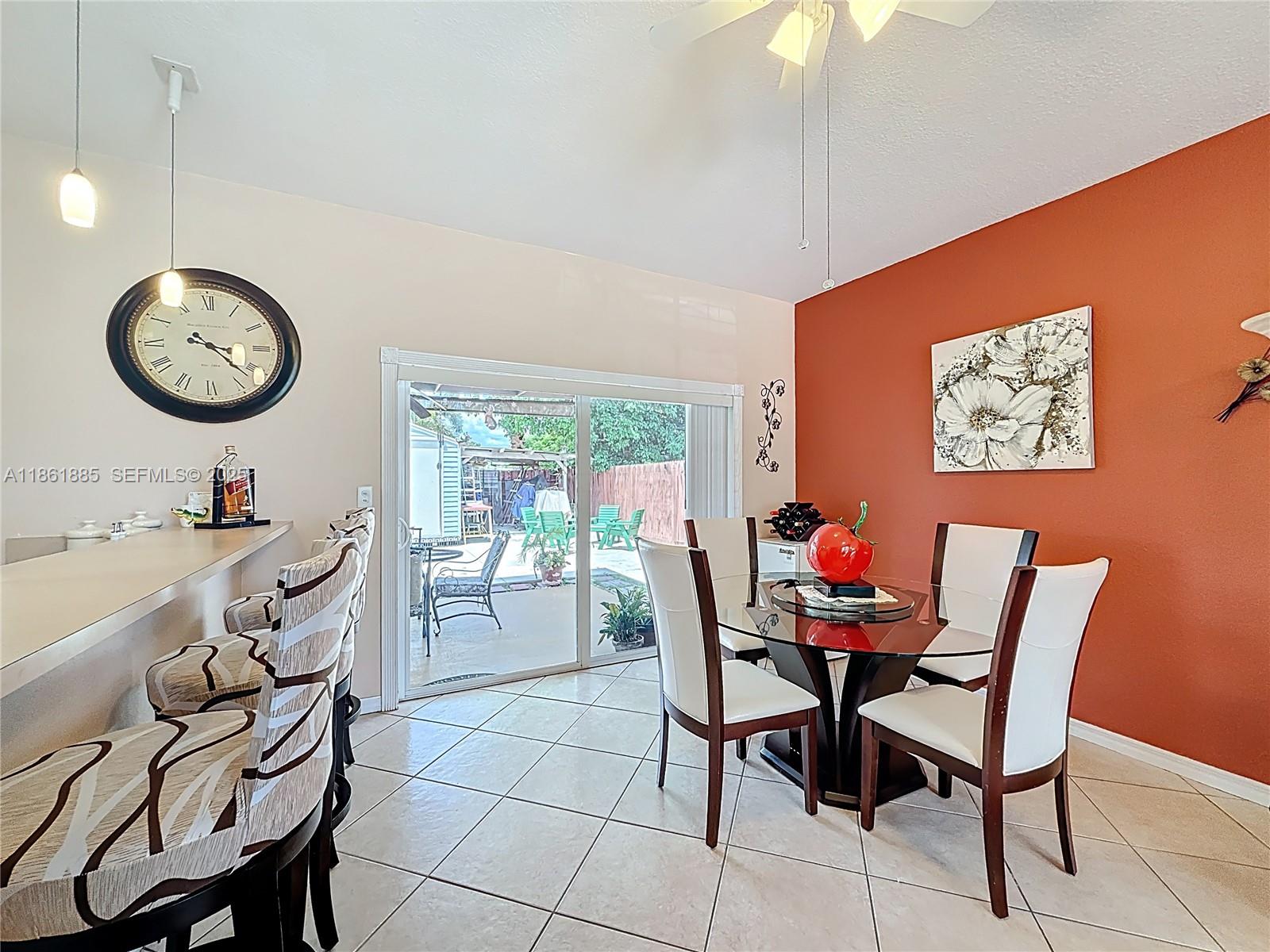 30030 Southwest 154th Avenue Homestead, FL 33033 - Photo 22 of 70 a dining room with furniture and window