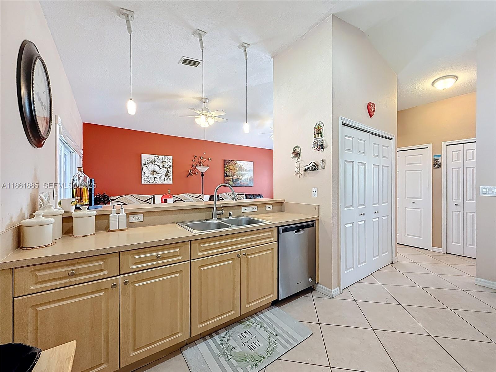 30030 Southwest 154th Avenue Homestead, FL 33033 - Photo 26 of 70 a large kitchen with stainless steel appliances granite countertop a sink and a refrigerator