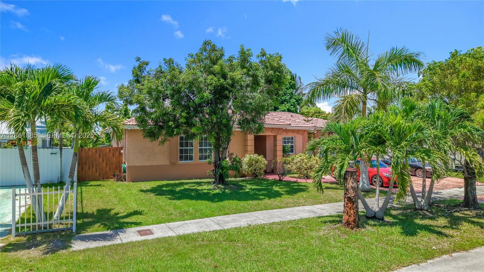 30030 Southwest 154th Avenue Homestead, FL 33033 - Photo 3 of 70 a garden with palm trees