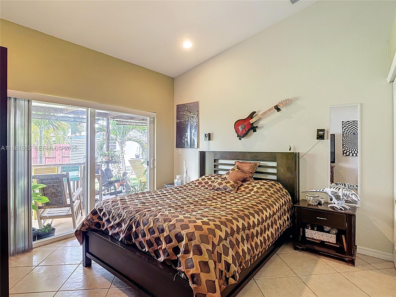 30030 Southwest 154th Avenue Homestead, FL 33033 - Photo 33 of 70 a bedroom with a bed and a window