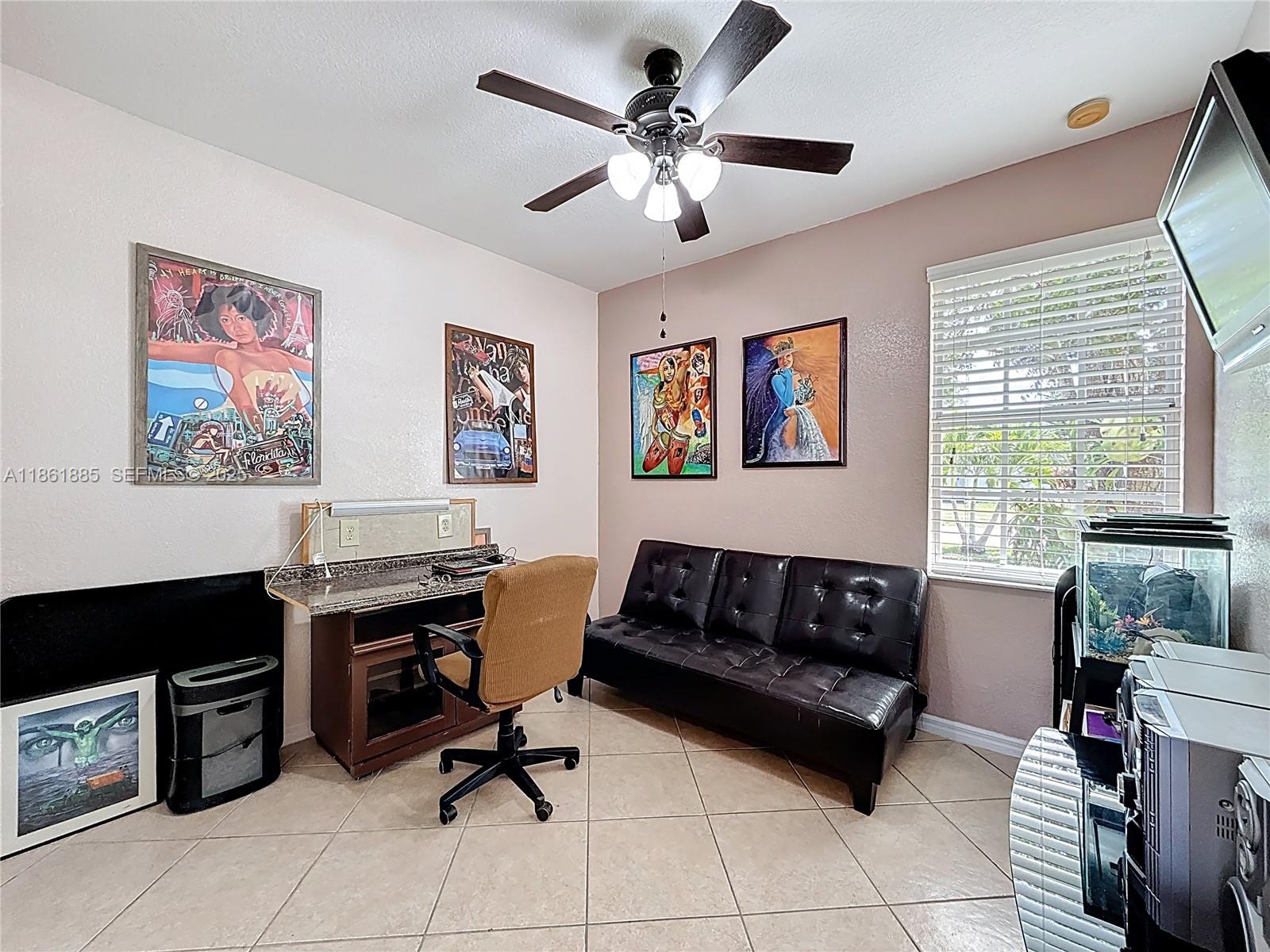 30030 Southwest 154th Avenue Homestead, FL 33033 - Photo 37 of 70 a view of a livingroom with workspace and a couch
