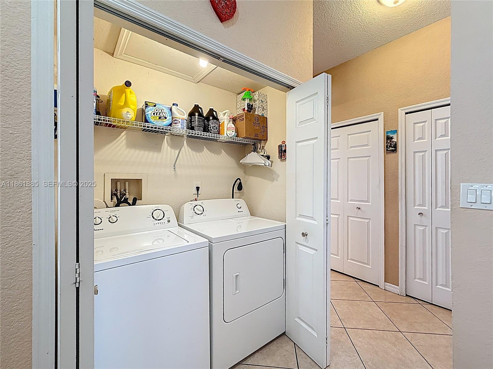 30030 Southwest 154th Avenue Homestead, FL 33033 - Photo 46 of 70 a utility room with dryer and washer