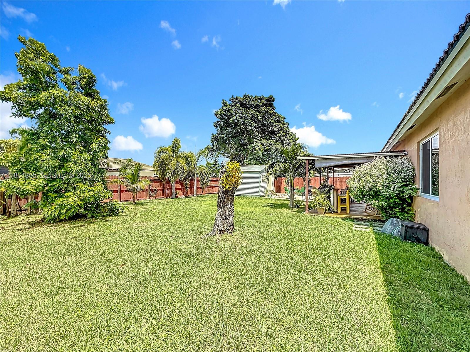 30030 Southwest 154th Avenue Homestead, FL 33033 - Photo 54 of 70 a garden view with a fountain